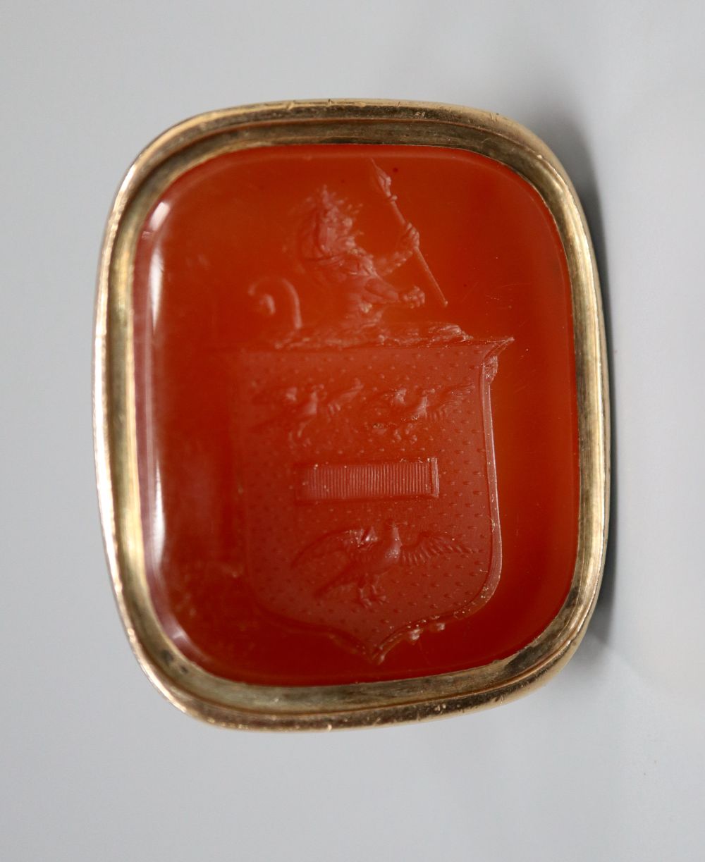 A 19th century gold (tests as 14ct) fob seal with intaglio-cut carnelian matrix, 30mm, gross 15.9 grams.